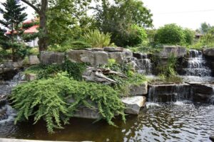 small Waterfall in the pond at the Saginaw Children's zoo sending water into the pond