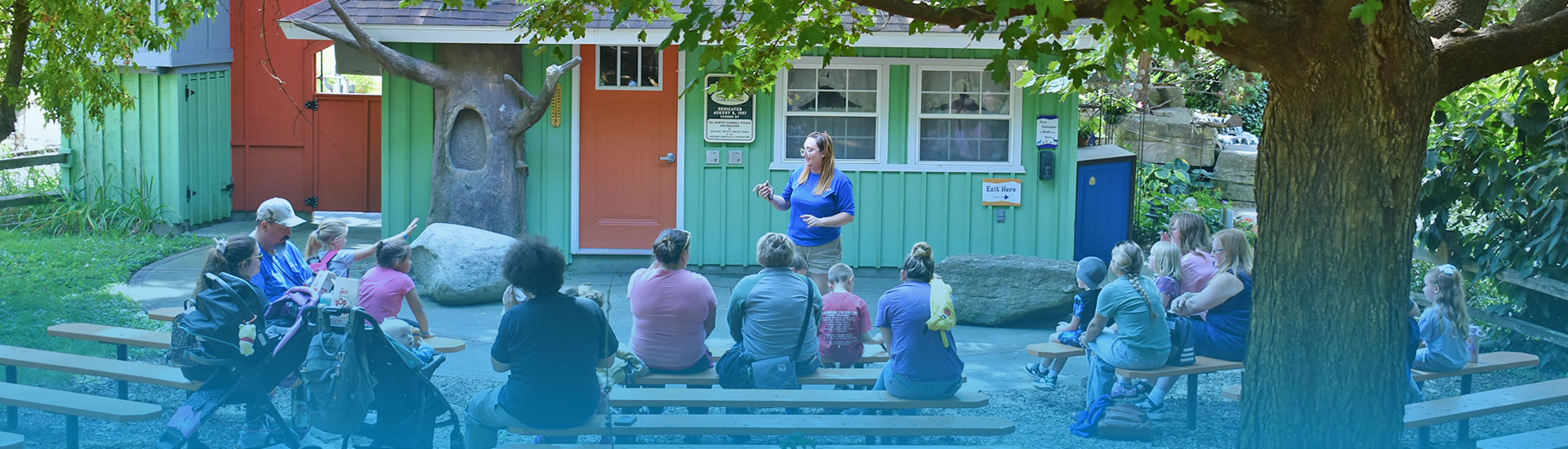 Zookeeper giving an animal presentation at the Awareness Amphitheater